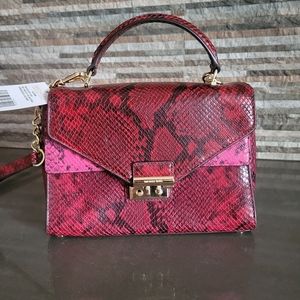 Michael Kors snake ski. Print leather handbag.